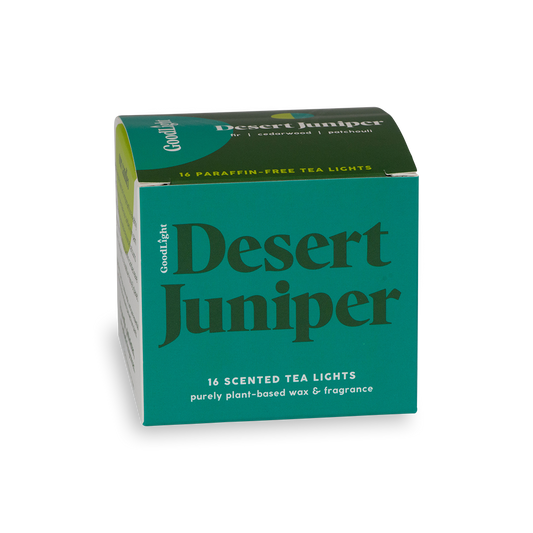 Green and blue box of GoodLight's Desert Juniper scented tea lights on a white background