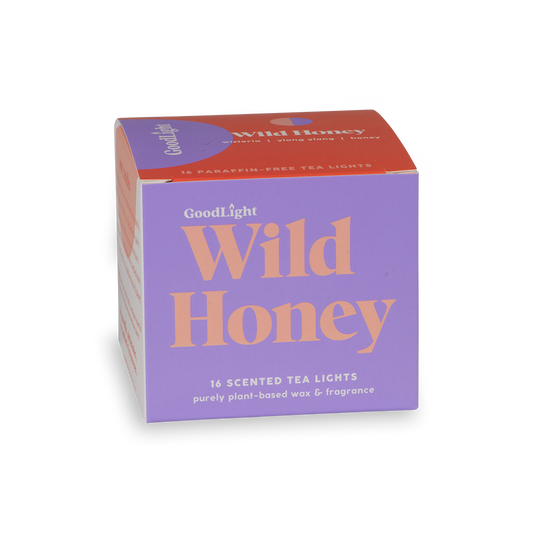 Box of GoodLight Wild Honey scented tea lights on a white background