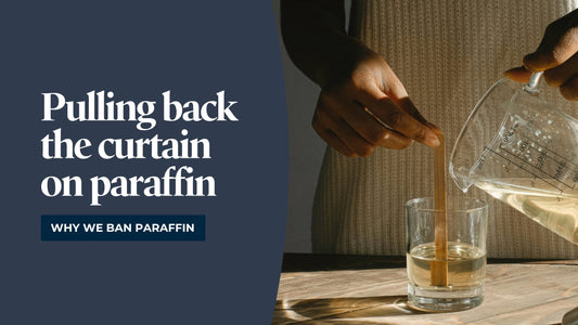A person putting a brown stick in a liquid while pouring more liquid into the jar with a graphic that reads, "Pulling back the curtain on paraffin"