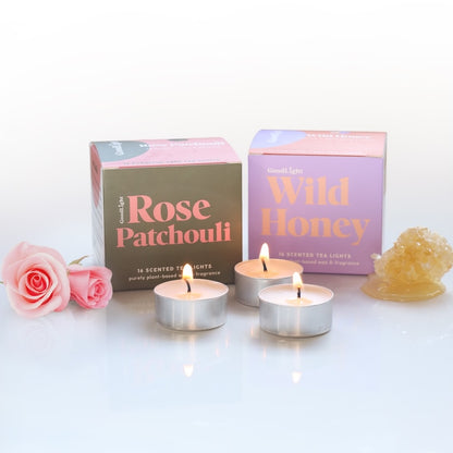 Three tea light candles with Rose Patchouli and Wild Honey packaging on a white surface
