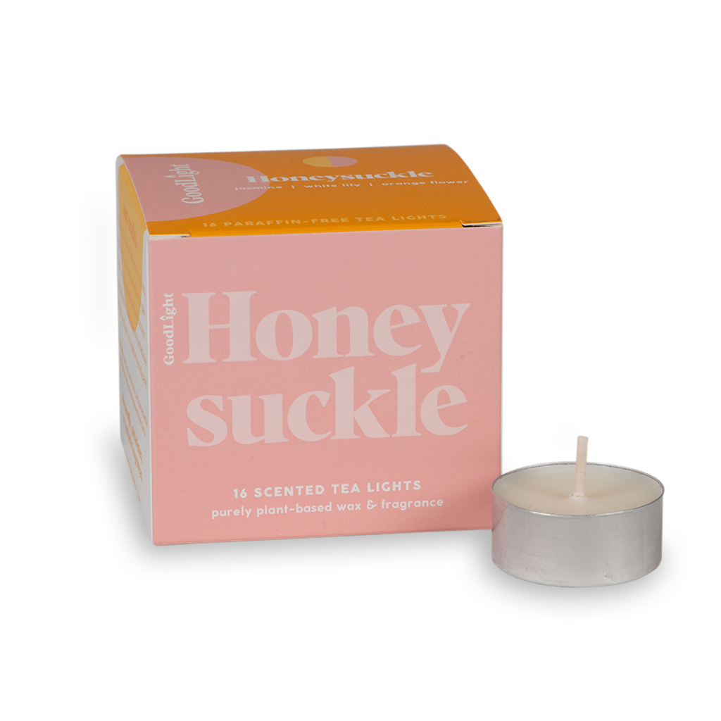 Honeysuckle scented tea light candles with pink and orange packaging on a white background