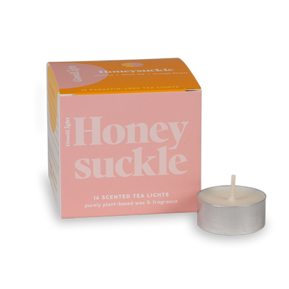 Honeysuckle scented tea light candles with pink and orange packaging on a white background