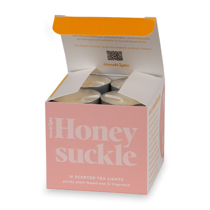 Open box of GoodLight's Honeysuckle scented tea lights 