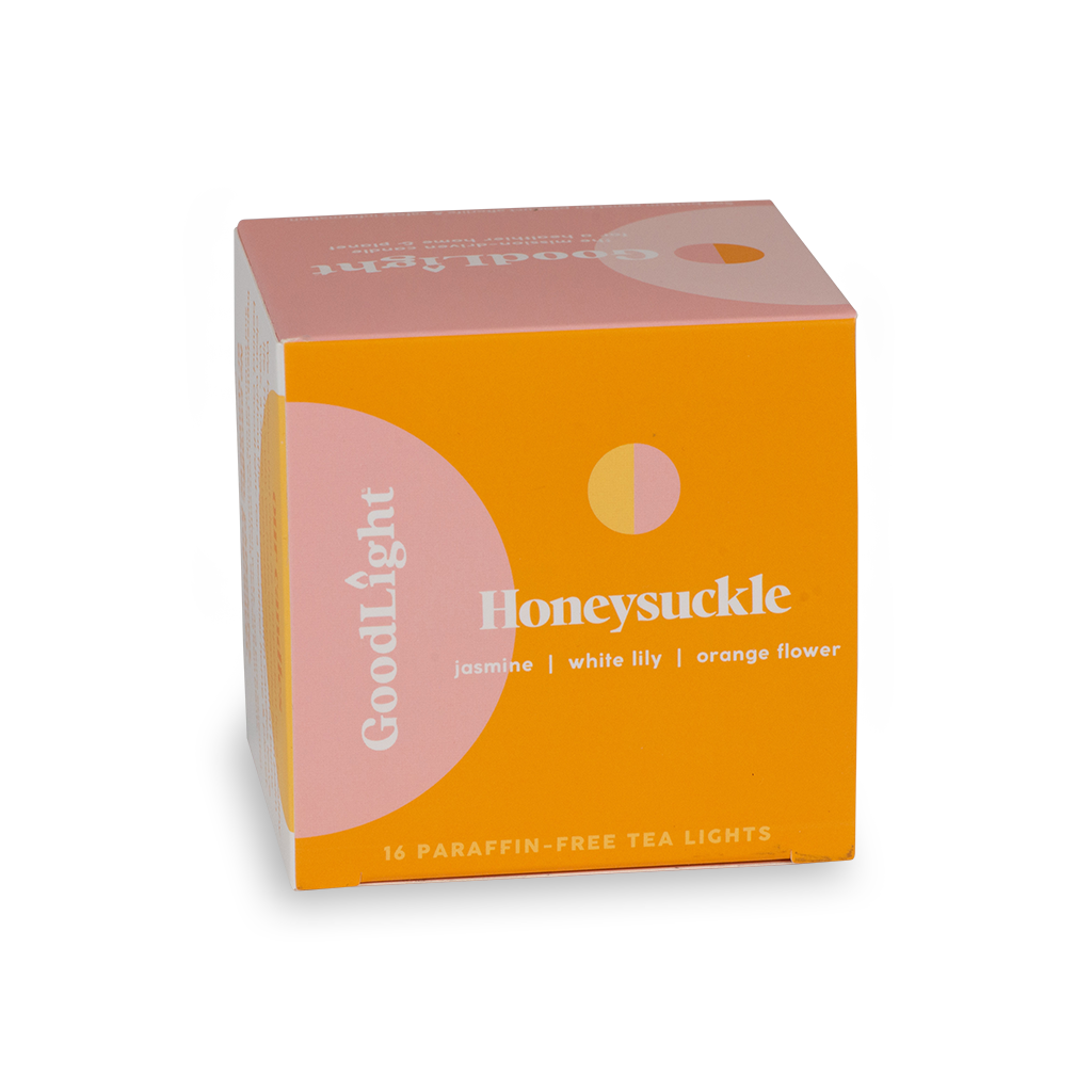 Box of GoodLight Honeysuckle tea lights on a white background