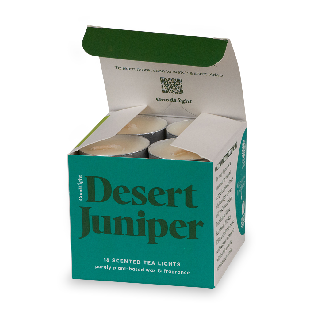 An open box of 'Desert Juniper' scented tea lights 