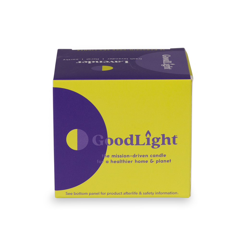 Purple and yellow GoodLight candle packaging on a white background