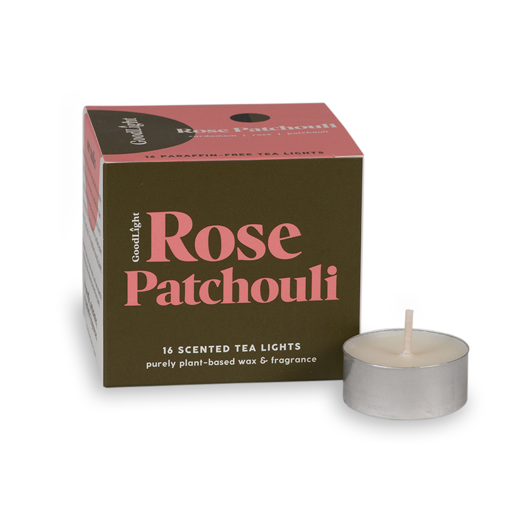 Rose Patchouli scented tea light candle with packaging on a white background