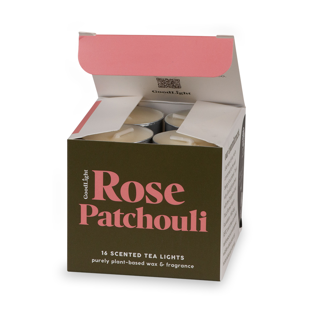 An open box of GoodLight Rose Patchouli scented tea lights on a white background