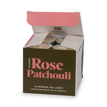 An open box of GoodLight Rose Patchouli scented tea lights on a white background