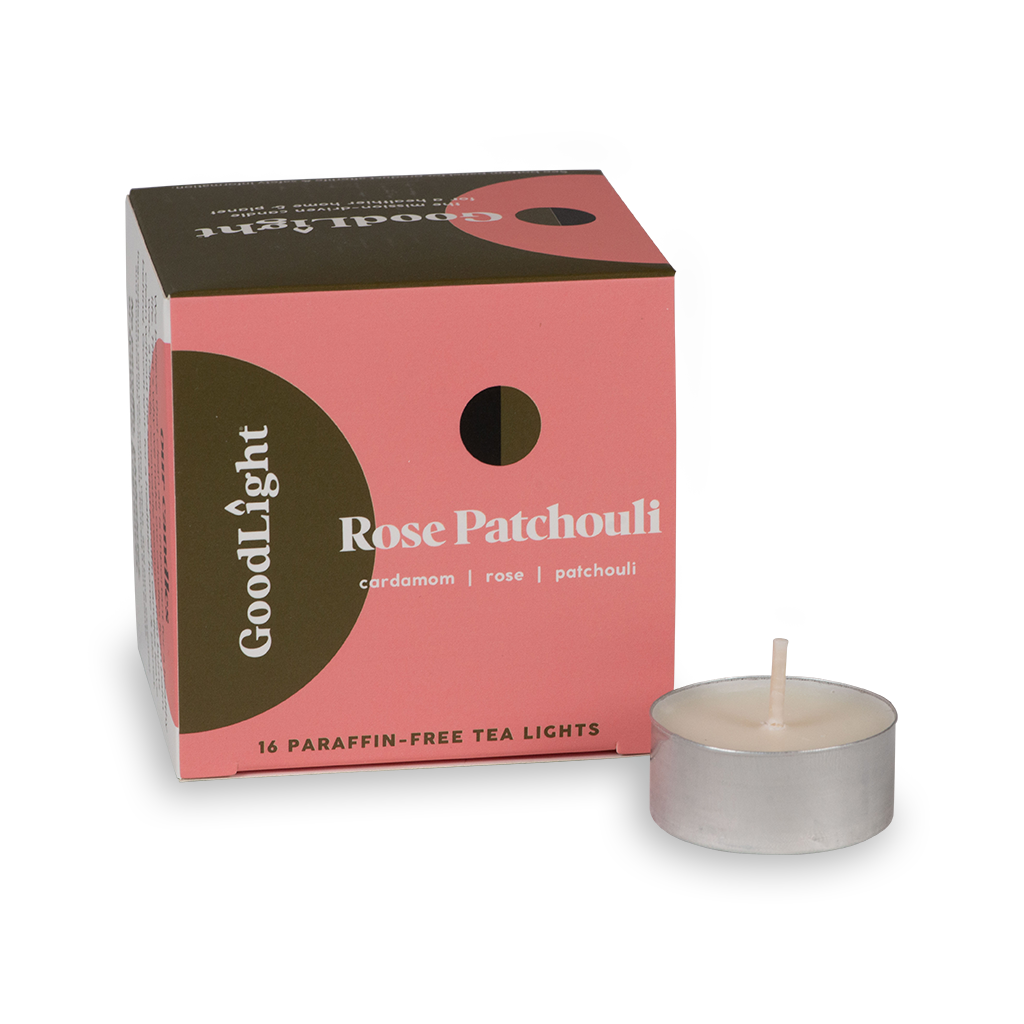Rose Patchouli tea light candle with GoodLight packaging on a white background